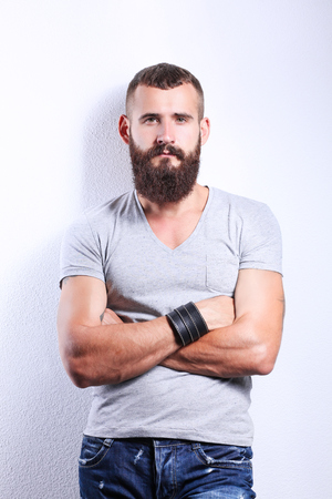 Portrait of handsome man standing, isolated on grey backgroundの写真素材