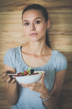 A beautiful girl eating healthy food. Beautiful girlの写真素材