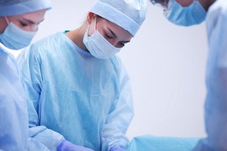 Team surgeon at work in operating roomの写真素材