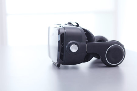 Virtual reality goggles on desk with laptop. business. 3d technology