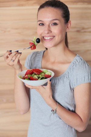 A beautiful girl eating healthy food. Beautiful girlの写真素材