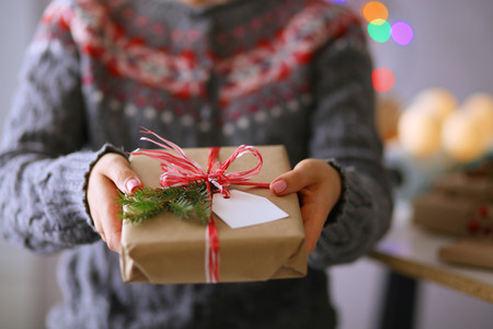 Hands of woman holding christmas gift box. Christmasの写真素材