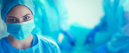 Team surgeon at work in operating roomの写真素材