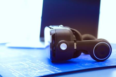 Virtual reality goggles on desk with laptop. business. 3d technologyの写真素材