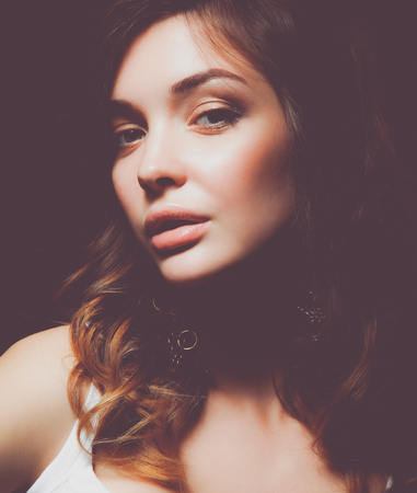 Close up portrait of beautiful young woman face. Isolated on white background.の写真素材