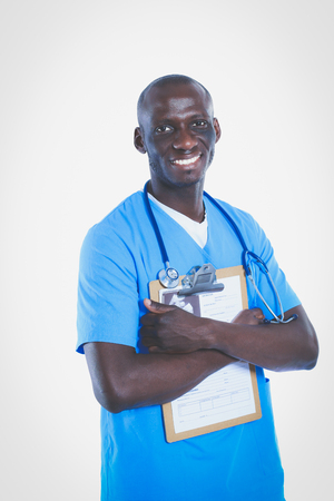 Male doctor standing with folder, isolated on white background. Doctor. Clinic.の写真素材