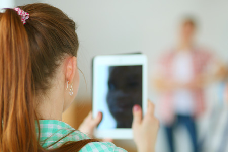 Portrait of young couple moving in new home. Young coupleの写真素材