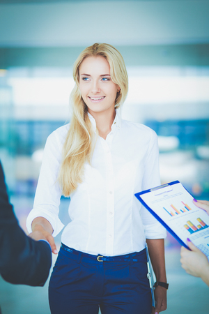 Two successful business people shaking hands with each other. Two successful business peopleの写真素材