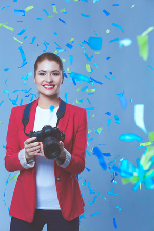 Beautiful happy woman at celebration party with confetti .Birthday or New Year eve celebrating conceptの写真素材