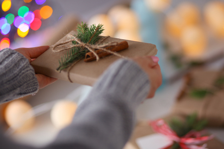 Hands of woman holding christmas gift box. Christmasの写真素材