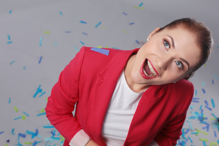 Portreit beautiful happy woman at celebration party with confetti .Birthday or New Year eve celebrating concept.の写真素材