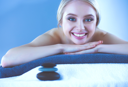 Young woman lying on a massage table,relaxing . Woman. Spa salonの写真素材