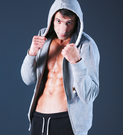 Profile view of young man practicing boxing .Personal instructorの写真素材