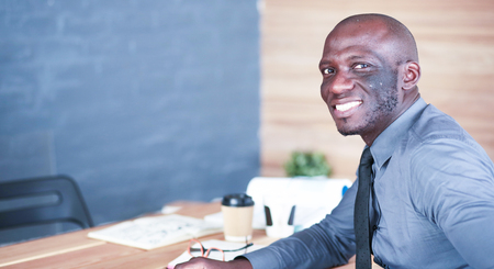 Portrait of an handsome young black businessman.の写真素材