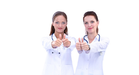Two young woman doctor , standing in hospitalの写真素材