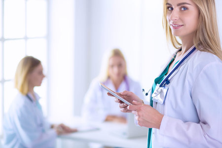 Woman doctor standing with stethoscope at hospital . Woman doctorの写真素材