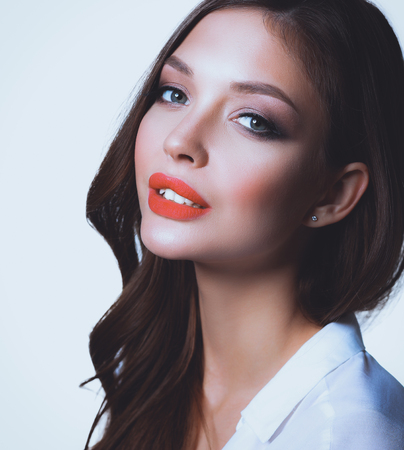 Portrait of beautiful young woman . Isolated on white backgroundの写真素材