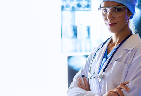 Image of attractive woman doctor looking at x-ray results.の写真素材