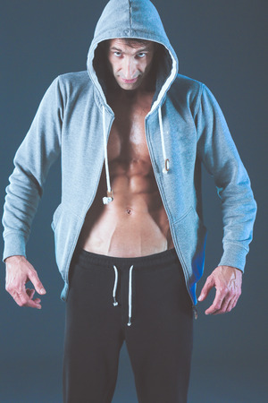 Profile view of young man practicing boxing .Personal instructor. Personal training.の写真素材