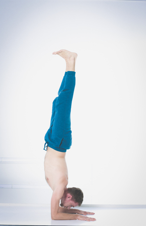 Young man practicing yoga.の写真素材