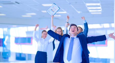 Portrait of young businessman in office with colleagues in the background . Portrait of young businessman.の写真素材