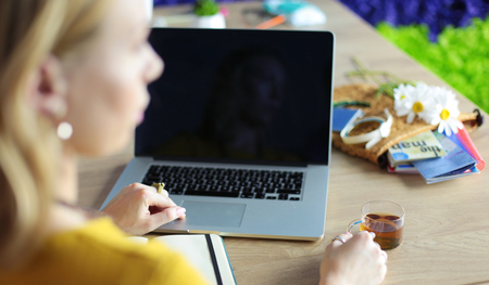 Young woman holding credit card and using laptop computer. Online shopping conceptの写真素材