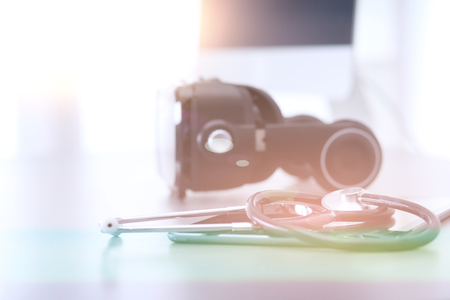 Virtual reality goggles on desk with laptop. business. 3d technologyの写真素材