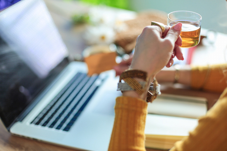 Young woman holding credit card and using laptop computer. Online shopping concept.の写真素材