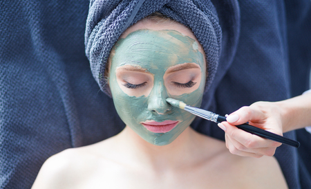 Beautiful woman having mask , lying on spa . Woman. Spa salonの写真素材