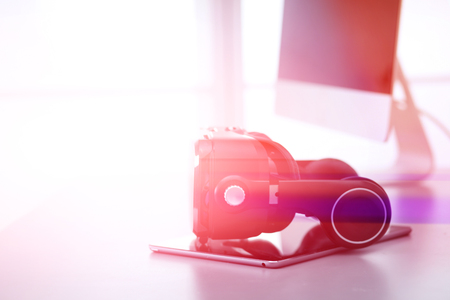 Virtual reality goggles on desk with laptop. business. 3d technologyの写真素材