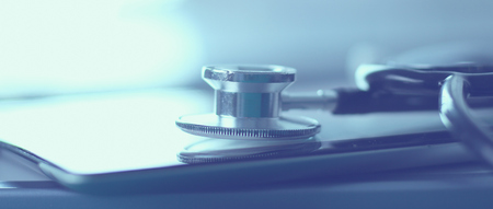 Medical equipment: blue stethoscope and tablet on white background. Medical equipment.の写真素材