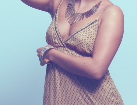 Young beautiful brunette woman with beads. Young beautiful brunette.の写真素材