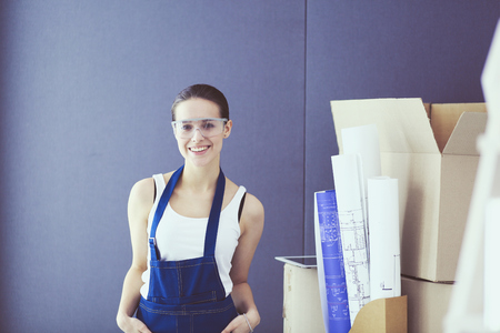 Young woman portrait while standing new apartment.の写真素材