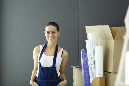 Young woman portrait while standing new apartment .の写真素材