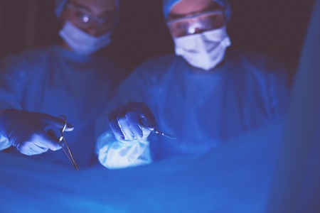 Cropped picture of scalpel taken doctors performing surgeryの写真素材