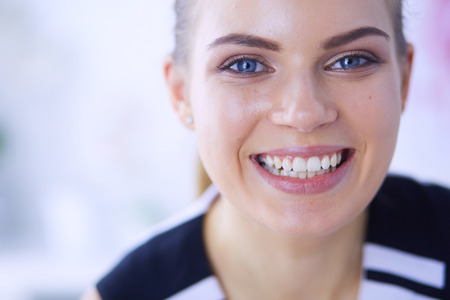 Close up portrait of healthy smiling woman lying at hospital.の写真素材
