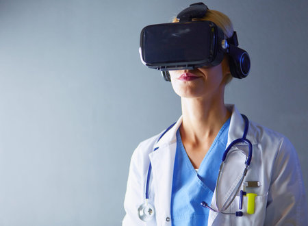 Female doctor wearing virtual reality glasses isolated on white background.