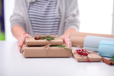 Hands of woman holding christmas gift box.の写真素材