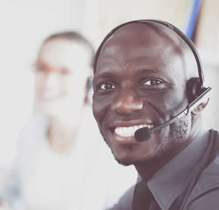 Portrait of an African American young business man with headset.の写真素材