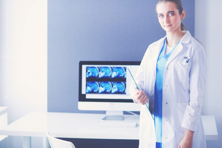Portrait of doctor with tablet in hands at hospital.の写真素材
