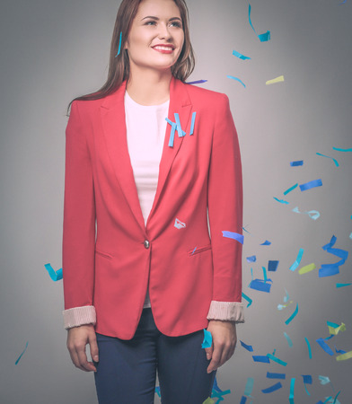Beautiful happy woman at celebration party with confetti .Birthday or New Year eve celebrating concept.の写真素材