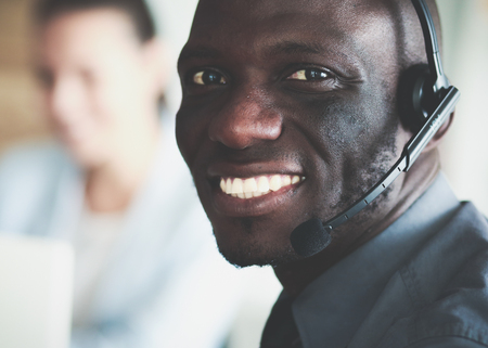 Portrait of an African American young business man with headset.の写真素材