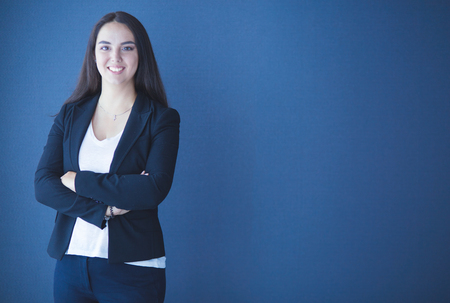 Portrait of smiling young business woman with digital tablet in her hands.の写真素材