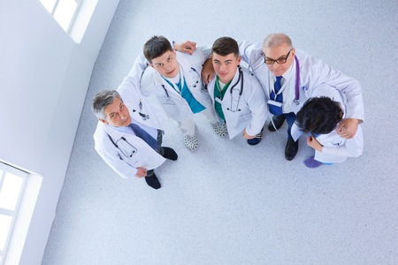 Successful medical team. Top view of confident doctors team standing together and smilingの写真素材