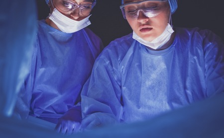 Cropped picture of scalpel taken doctors performing surgery.の写真素材