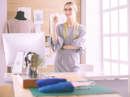 Modern young fashion designer working at studioの写真素材