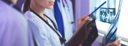 Hospital doctors looking at x-rays in an emergency room