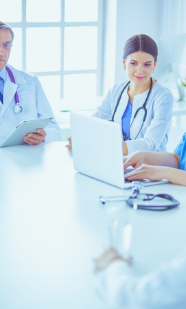 Serious medical team discussing patients case in a bright officeの写真素材