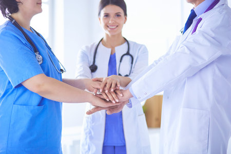 Group of doctors putting their hands together. Close-up