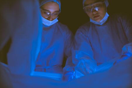 Cropped picture of scalpel taken doctors performing surgery.の写真素材